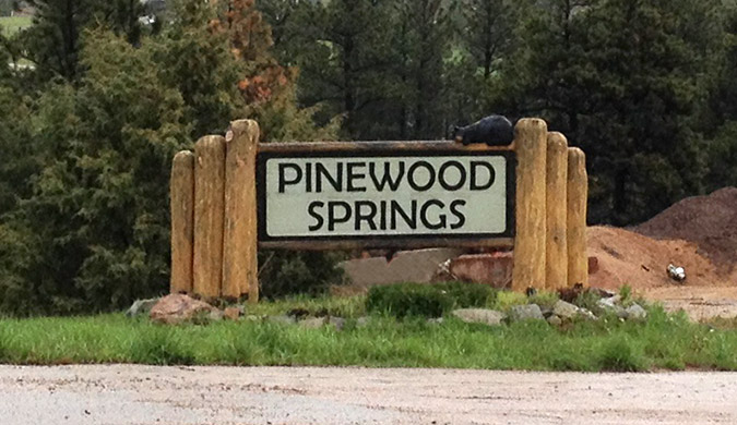 Photo of Pinewood Springs sign
